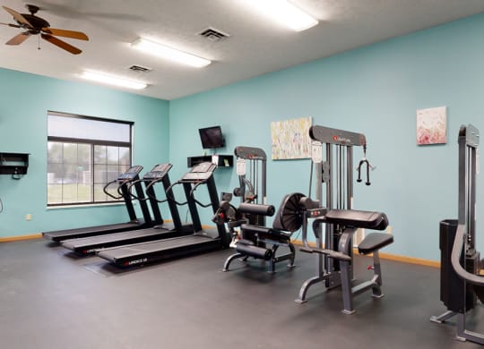 24 hour fitness center includes a treadmill, elliptical and many workout machines