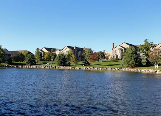 Villa buildings along a large pond