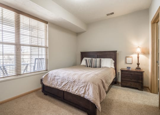 Interiors-Master bedroom in 1-bedroom townhome at Stone Ridge in South Lincoln NE