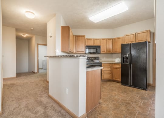 Large kitchen with side-by-side fridge at Stone Ridge Estates townhomes in south Lincoln NE