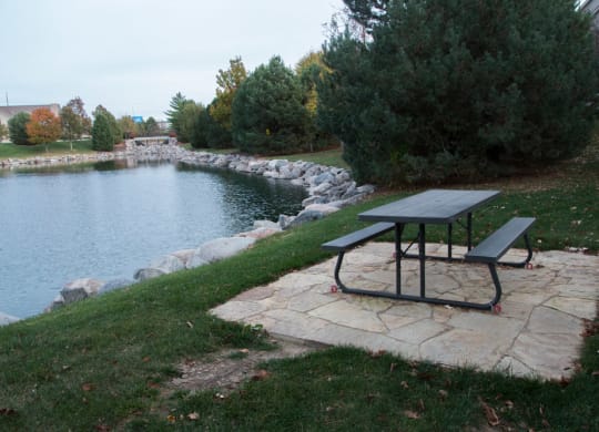 Picnic area overlooking private pond at Stone Ridge Estates in Lincoln NE