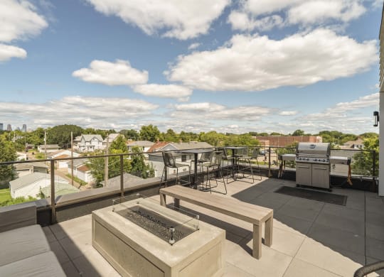Rooftop patio and outdoor firepit at The Central apartments near downtown Minneapolis MN 55408