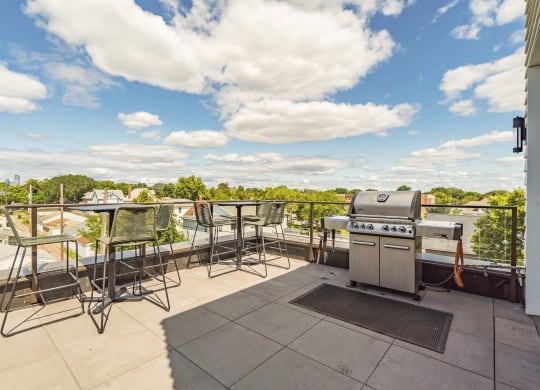 Rooftop patio and outdoor firepit at The Central apartments near downtown Minneapolis MN 55408