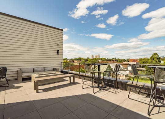 Rooftop patio and outdoor firepit at The Central apartments near downtown Minneapolis MN 55408