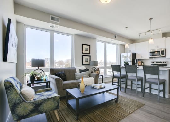 Open floor plan with white cabinetry and hardwood-style floors at The Central apartments near downtown Minneapolis MN 55408