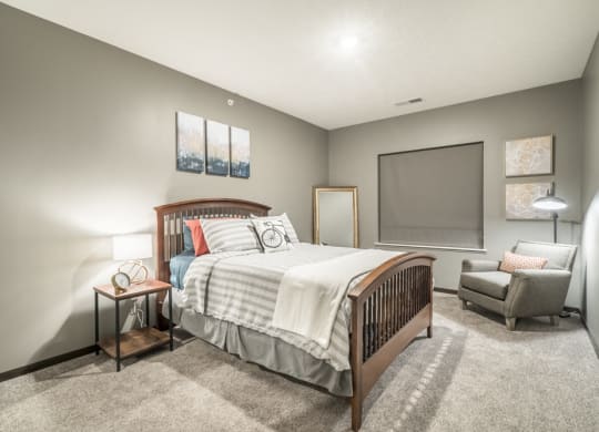 1-bedroom apartment with king-size bed and walk-in closet at The Conrad in Blackstone District Omaha