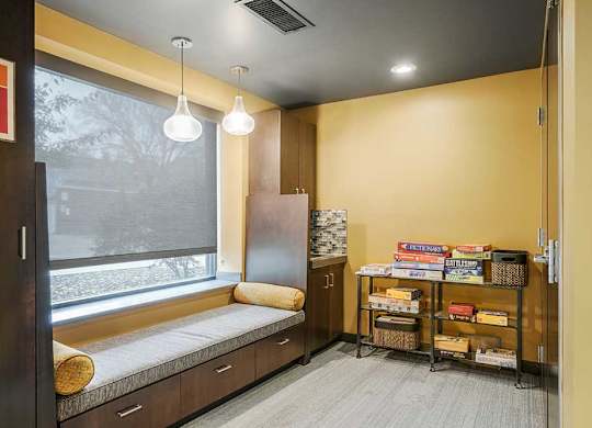 a pub room with built-in lounge/bench seating with board games