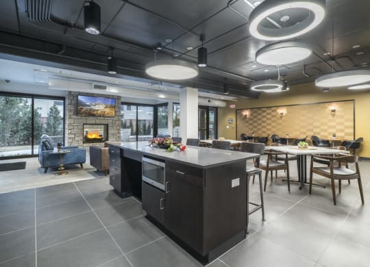 The Conrad clubhouse with kitchen and fireside seating-Blackstone District Omaha NE