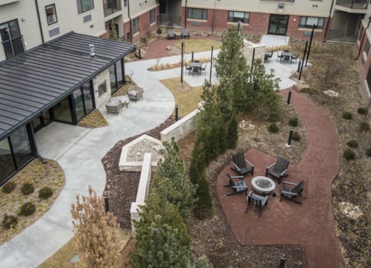 Courtyard park with fire pit at The Conrad in Omaha NE