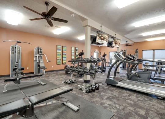 24-hour fitness center with weights and treadmills at The Flats at 84 in southeast Lincoln NE 68516