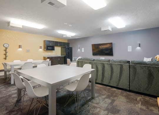 theater room with a table, chairs and a couch