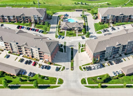 Arial view of the flats at 84 entrance with apartment buildings and swimming pool