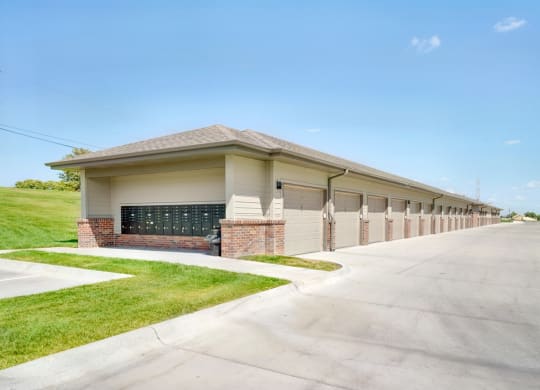 Row of garages and mailboxes on one end outside the Flats at Shadow Creek