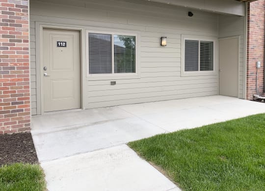 Outdoor patio area and entrance to apartment The Flats at Shadow Creek in Lincoln Nebraska