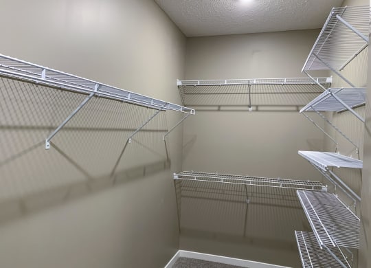 Walk in closet with plenty of shelving and hanging space