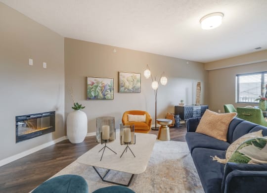 Spacious living room with modern fireplace at The Flats at Shadow Creek new luxury apartments in east Lincoln NE 68520