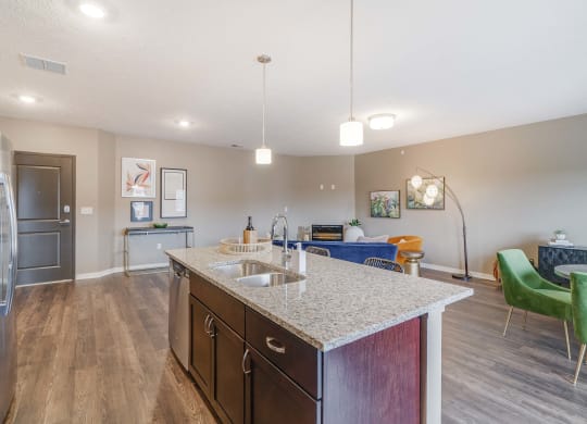 View of kitchen island and living room at The Flats at Shadow Creek