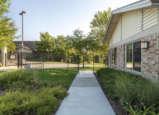 Gated entrance to Grand Legacy apartments and townhomes in west Omaha NE 68130