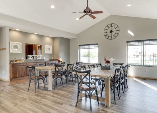 a clubhouse room with long tables and chairs for hosting events