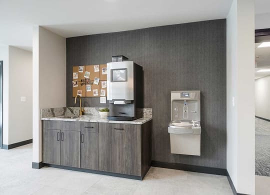 The clubhouse coffee bar with coffee machine and smart water fountain
