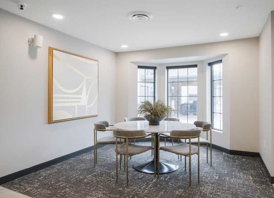 The dining room of the clubhouse kitchen featuring a large bay window
