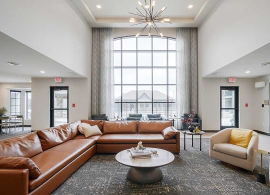 The clubhouse lounge with a floor to ceiling window and lounge seating
