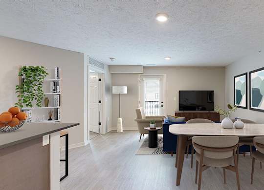 A living room and dining space with a TV, chair, couch, and table with four chairs