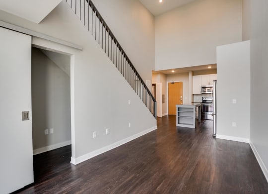 Living space with view of kitchen and bright natural lighting at The Preserve at Normandale Lake