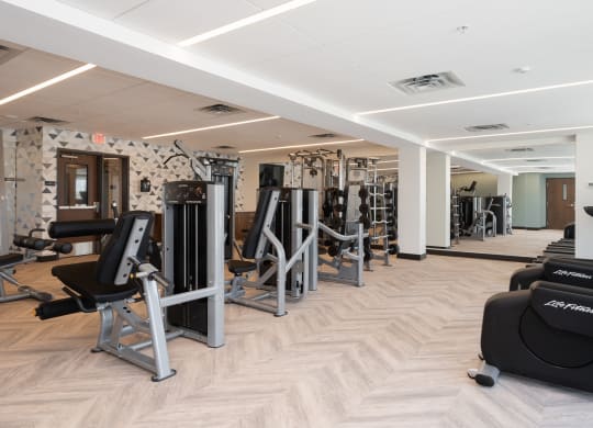 Community gym with a variety of workout and fitness equipment at The Rowan