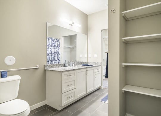 Interiors-Large master bathroom with built-in shelving
