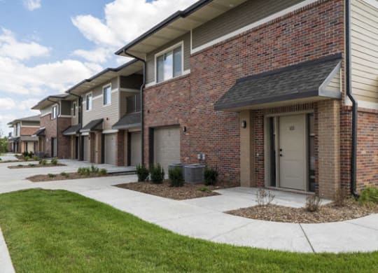 Private entrances and attached garages at The Villas at Falling Waters luxury townhomes in west Omaha NE