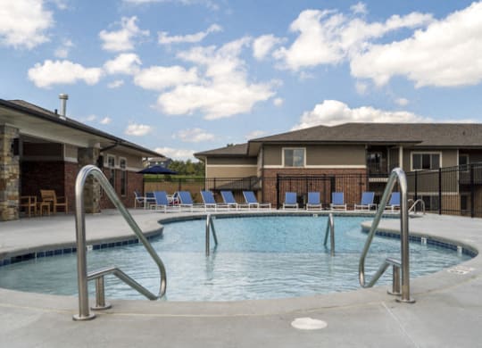 Resort-style pool with shallow soaking area at The Villas at Falling Waters townhomes for rent in west Omaha NE