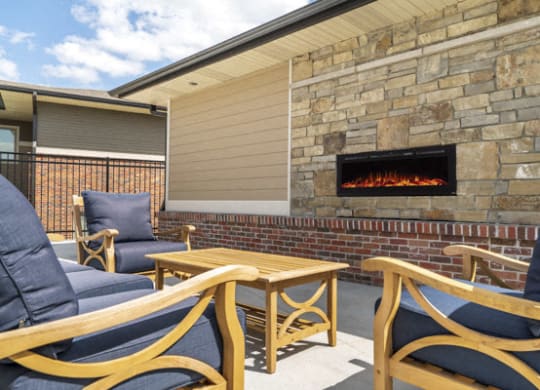 Outdoor fireplace and lounge at The Villas at Falling Waters townhomes for rent in West Omaha