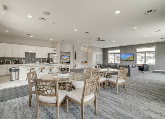 Clubhouse interior with kitchen and TV lounge for resident use at The Villas at Falling Waters townhomes in west Omaha NE