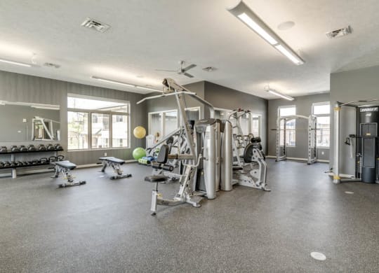 Fitness center with free weights and weightlifting machines at The Villas at Falling Waters townhomes in West Omaha NE