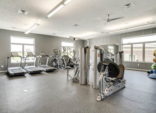 Nice fitness center with treadmills and weightlifting machines at The Villas at Falling Waters in west Omaha NE