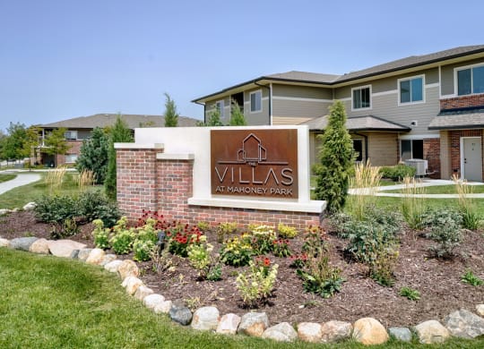 Copper and brick exterior sign that reads