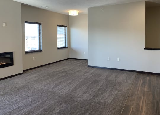 carpeted living room and nook area