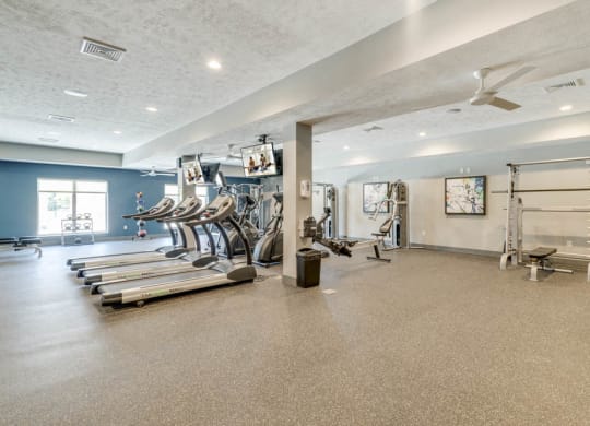 Large fitness center with a variety of equipment at The Villas at Mahoney Park