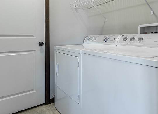 white washer and dryer in laundry room