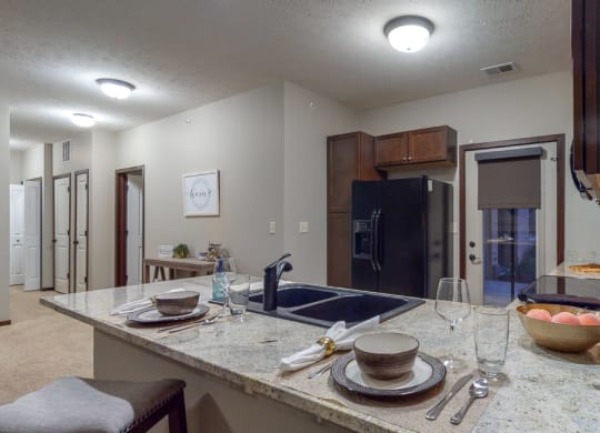 The 2-bedroom Cedar features a spacious kitchen with peninsula counter and gorgeous countertops.