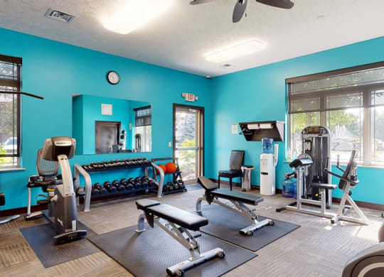 24 hour fitness center with strength training equipment and machines at The Villas at Wilderness Ridge  in Lincoln Nebraska