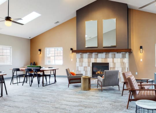 Large clubhouse with vaulted ceiling, fireplace and multiple sitting areas at the Northbrook Apartments