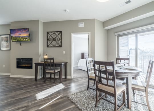 Dinning room table and desk in the living space at The Villas at Mahoney Park