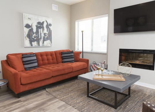 Living room space with fireplace at The Villas at Mahoney Park