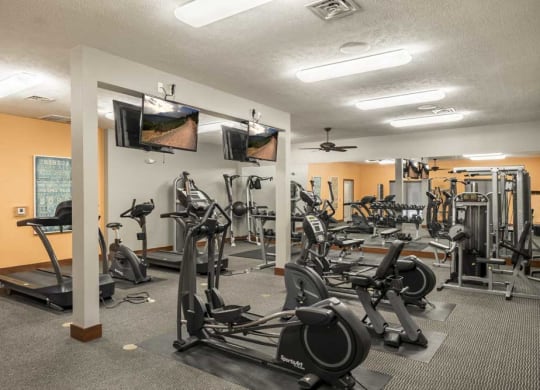 24-hour fitness center with cardio equipment at Villas of Omaha townhome apartments in northwest Omaha NE 68116