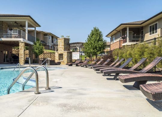 Lounge chairs by the pool at Villas of Omaha in northwest Omaha NE 68116