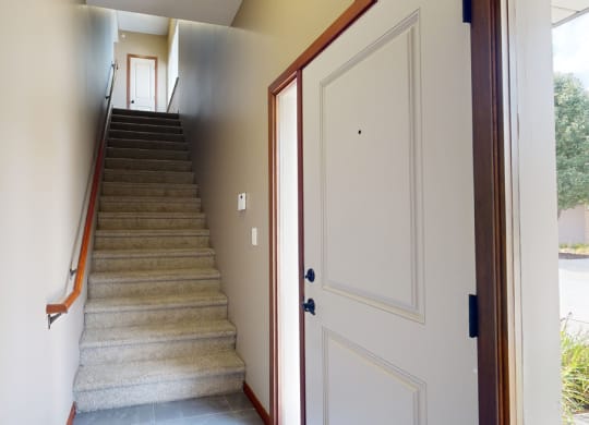 a private staircase leading from the front door to the
