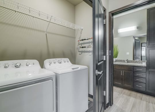 Laundry area and spacious bathroom at WH Flats new luxury apartments in south Lincoln NE 68516