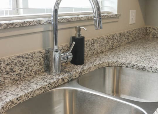 Grohe-brand faucet in kitchen at WH Flats new luxury apartments in south Lincoln NE 68516